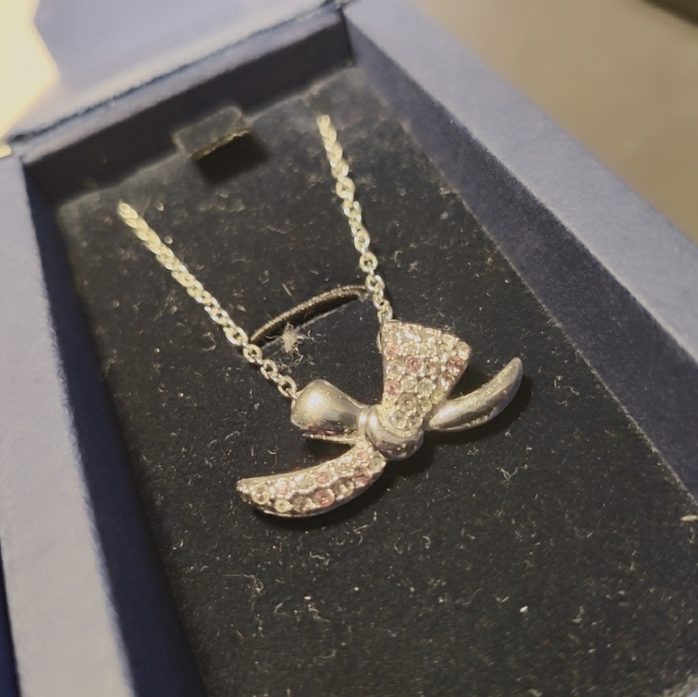 Brand new Swarovski bow necklace